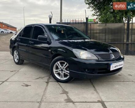Черный Мицубиси Лансер, объемом двигателя 2 л и пробегом 248 тыс. км за 5190 $, фото 1 на Automoto.ua