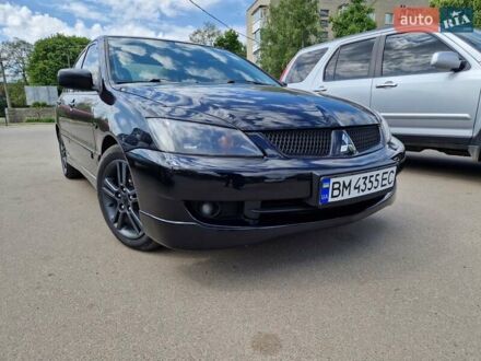 Міцубісі Lancer 2006 у Путивле на Automoto.ua Чорний Міцубісі Lancer, об'ємом двигуна 2 л та пробігом 290 тис. км за 5000 $, фото 1 на Automoto.ua