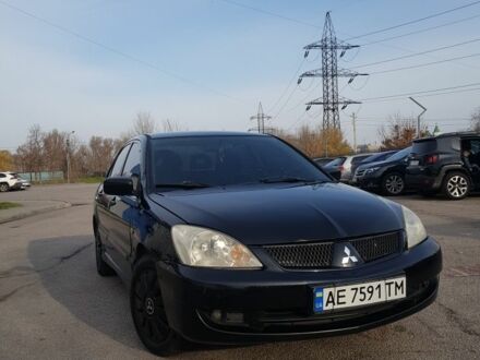 Черный Мицубиси Лансер, объемом двигателя 1.6 л и пробегом 290 тыс. км за 3200 $, фото 1 на Automoto.ua