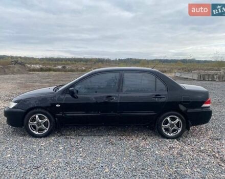 Чорний Міцубісі Lancer, об'ємом двигуна 1.6 л та пробігом 335 тис. км за 3500 $, фото 1 на Automoto.ua