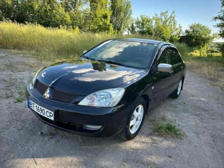 Черный Мицубиси Лансер, объемом двигателя 1.6 л и пробегом 289 тыс. км за 3200 $, фото 1 на Automoto.ua