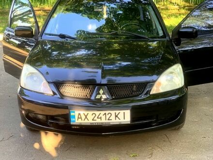 Черный Мицубиси Лансер, объемом двигателя 1.6 л и пробегом 285 тыс. км за 4400 $, фото 1 на Automoto.ua