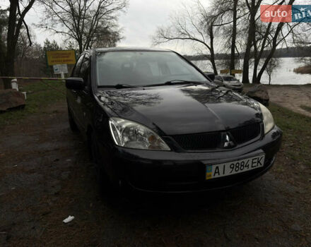 Черный Мицубиси Лансер, объемом двигателя 1.58 л и пробегом 210 тыс. км за 3900 $, фото 1 на Automoto.ua