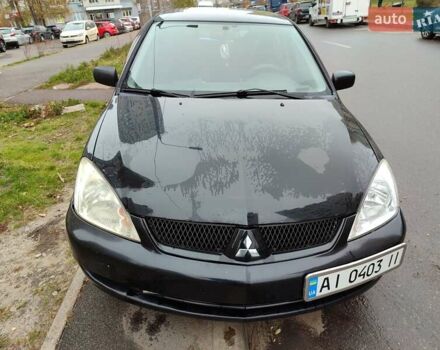 Черный Мицубиси Лансер, объемом двигателя 1.58 л и пробегом 270 тыс. км за 4000 $, фото 1 на Automoto.ua
