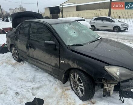 Черный Мицубиси Лансер, объемом двигателя 2 л и пробегом 251 тыс. км за 2500 $, фото 1 на Automoto.ua