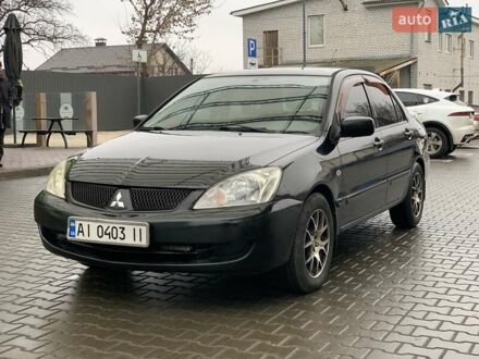 Черный Мицубиси Лансер, объемом двигателя 1.58 л и пробегом 270 тыс. км за 3950 $, фото 1 на Automoto.ua