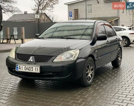 Черный Мицубиси Лансер, объемом двигателя 1.58 л и пробегом 270 тыс. км за 3950 $, фото 1 на Automoto.ua