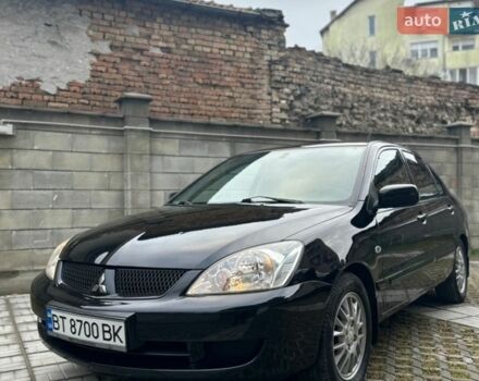 Черный Мицубиси Лансер, объемом двигателя 1.58 л и пробегом 222 тыс. км за 5200 $, фото 1 на Automoto.ua