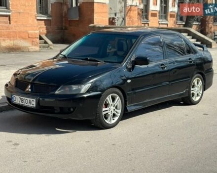 Черный Мицубиси Лансер, объемом двигателя 2 л и пробегом 265 тыс. км за 4100 $, фото 1 на Automoto.ua