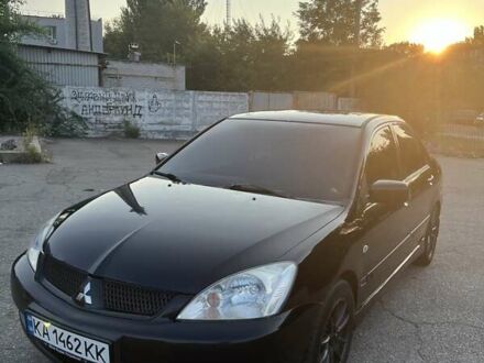 Мицубиси Лансер 2006 в Запорожье на Automoto.ua Черный Мицубиси Лансер, объемом двигателя 1.6 л и пробегом 219 тыс. км за 4200 $, фото 1 на Automoto.ua