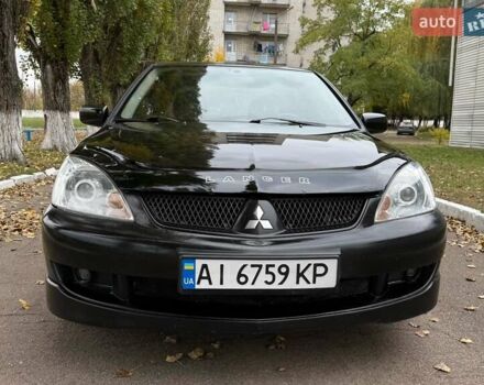 Чорний Міцубісі Lancer, об'ємом двигуна 1.58 л та пробігом 386 тис. км за 4450 $, фото 1 на Automoto.ua