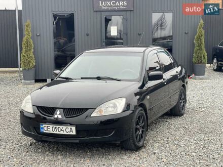Чорний Міцубісі Lancer, об'ємом двигуна 1.58 л та пробігом 230 тис. км за 3350 $, фото 1 на Automoto.ua
