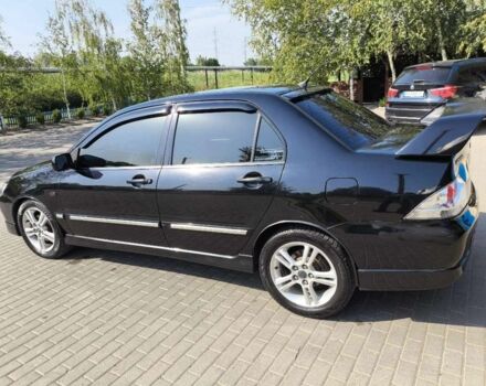 Чорний Міцубісі Lancer, об'ємом двигуна 2 л та пробігом 240 тис. км за 5600 $, фото 1 на Automoto.ua