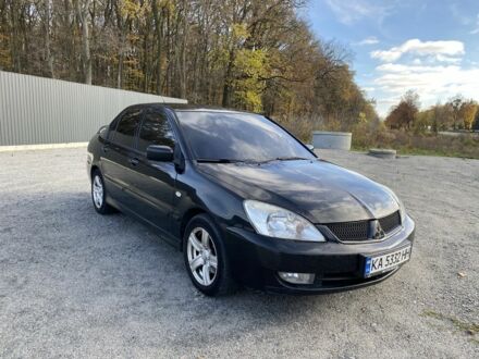 Черный Мицубиси Лансер, объемом двигателя 1.6 л и пробегом 200 тыс. км за 3400 $, фото 1 на Automoto.ua