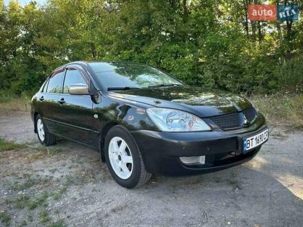 Мицубиси Лансер 2006 в Киеве на Automoto.ua Черный Мицубиси Лансер, объемом двигателя 1.58 л и пробегом 268 тыс. км за 3400 $, фото 1 на Automoto.ua