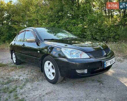 Мицубиси Лансер 2006 в Киеве на Automoto.ua Черный Мицубиси Лансер, объемом двигателя 1.58 л и пробегом 268 тыс. км за 3400 $, фото 1 на Automoto.ua