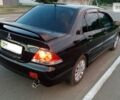 Чорний Міцубісі Lancer, об'ємом двигуна 1.6 л та пробігом 78 тис. км за 6000 $, фото 1 на Automoto.ua