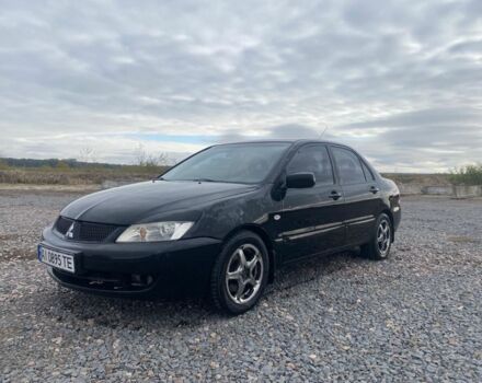 Чорний Міцубісі Lancer, об'ємом двигуна 1.6 л та пробігом 335 тис. км за 3500 $, фото 1 на Automoto.ua