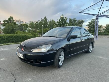 Міцубісі Lancer 2006 у Києві на Automoto.ua Чорний Міцубісі Lancer, об'ємом двигуна 2 л та пробігом 261 тис. км за 4200 $, фото 1 на Automoto.ua