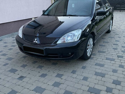 Черный Мицубиси Лансер, объемом двигателя 1.6 л и пробегом 170 тыс. км за 4900 $, фото 1 на Automoto.ua