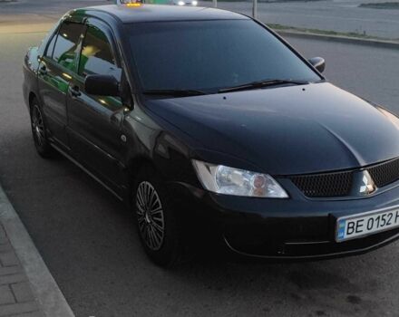 Черный Мицубиси Лансер, объемом двигателя 1.6 л и пробегом 245 тыс. км за 3600 $, фото 1 на Automoto.ua