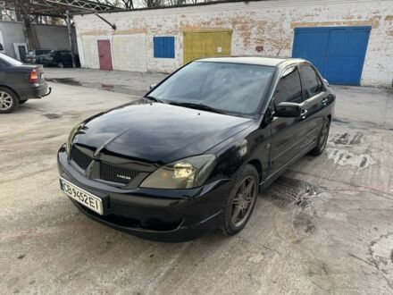 Черный Мицубиси Лансер, объемом двигателя 2 л и пробегом 3 тыс. км за 3700 $, фото 1 на Automoto.ua