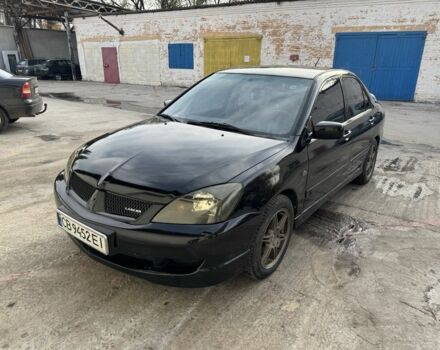 Черный Мицубиси Лансер, объемом двигателя 2 л и пробегом 3 тыс. км за 3700 $, фото 1 на Automoto.ua