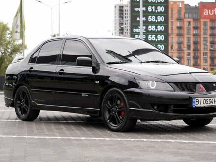 Чорний Міцубісі Lancer, об'ємом двигуна 2 л та пробігом 253 тис. км за 6900 $, фото 1 на Automoto.ua