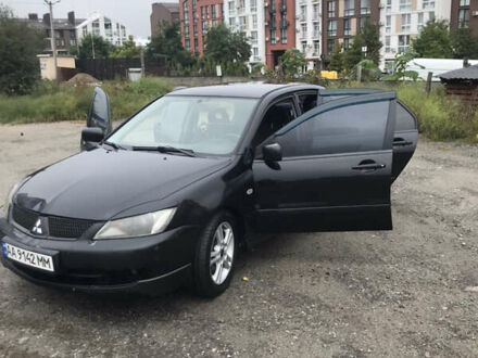 Міцубісі Lancer 2006 у Києві на Automoto.ua Чорний Міцубісі Lancer, об'ємом двигуна 2 л та пробігом 309 тис. км за 4500 $, фото 1 на Automoto.ua
