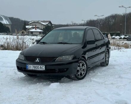 Черный Мицубиси Лансер, объемом двигателя 2 л и пробегом 187 тыс. км за 4550 $, фото 1 на Automoto.ua