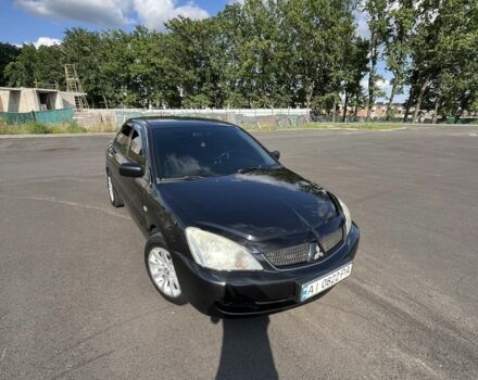 Чорний Міцубісі Lancer, об'ємом двигуна 1.6 л та пробігом 285 тис. км за 4700 $, фото 1 на Automoto.ua