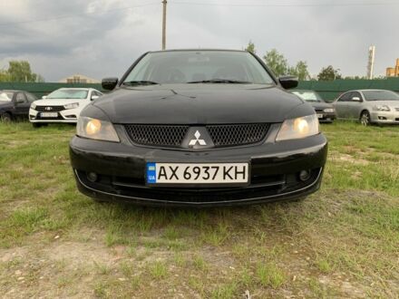 Чорний Міцубісі Lancer, об'ємом двигуна 2 л та пробігом 283 тис. км за 4200 $, фото 1 на Automoto.ua