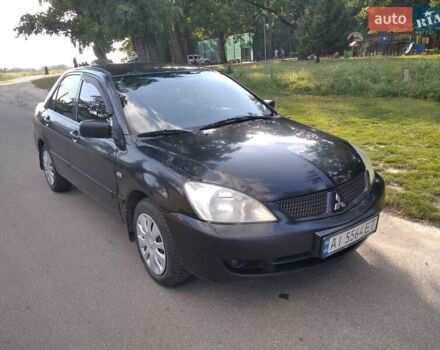 Чорний Міцубісі Lancer, об'ємом двигуна 1.58 л та пробігом 520 тис. км за 3400 $, фото 1 на Automoto.ua