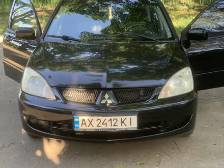 Мицубиси Лансер 2006 в Харькове на Automoto.ua Черный Мицубиси Лансер, объемом двигателя 1.6 л и пробегом 285 тыс. км за 4400 $, фото 1 на Automoto.ua