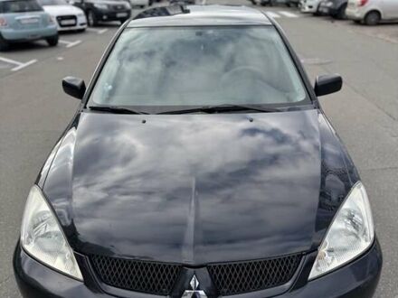 Чорний Міцубісі Lancer, об'ємом двигуна 1.58 л та пробігом 319 тис. км за 2700 $, фото 1 на Automoto.ua