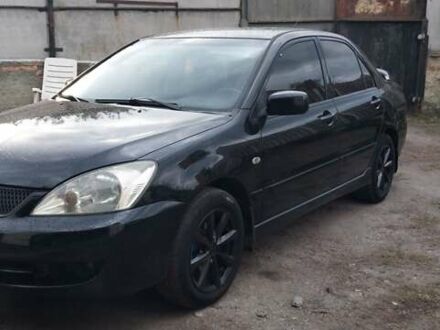 Чорний Міцубісі Lancer, об'ємом двигуна 1.59 л та пробігом 185 тис. км за 4900 $, фото 1 на Automoto.ua