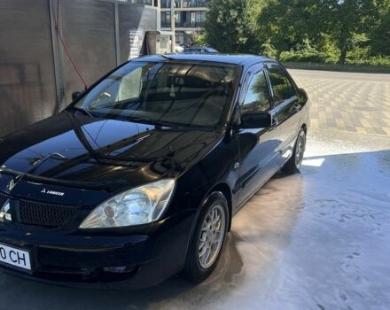 Чорний Міцубісі Lancer, об'ємом двигуна 1.6 л та пробігом 330 тис. км за 3200 $, фото 1 на Automoto.ua