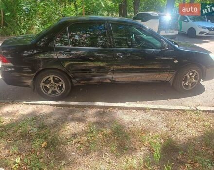 Чорний Міцубісі Lancer, об'ємом двигуна 1.58 л та пробігом 200 тис. км за 4200 $, фото 1 на Automoto.ua