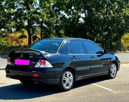 Чорний Міцубісі Lancer, об'ємом двигуна 2 л та пробігом 238 тис. км за 3700 $, фото 1 на Automoto.ua