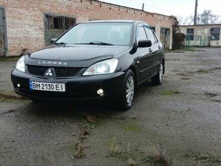 Черный Мицубиси Лансер, объемом двигателя 1.6 л и пробегом 230 тыс. км за 3250 $, фото 1 на Automoto.ua