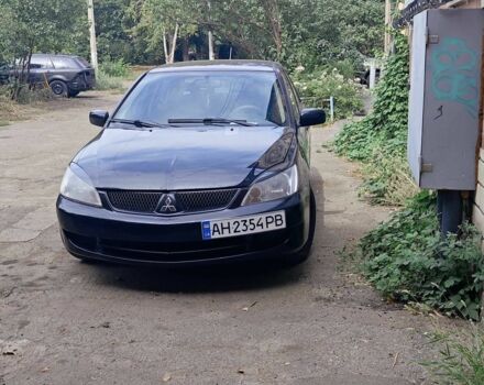Черный Мицубиси Лансер, объемом двигателя 1.6 л и пробегом 250 тыс. км за 2083 $, фото 1 на Automoto.ua