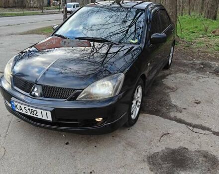 Чорний Міцубісі Lancer, об'ємом двигуна 2 л та пробігом 245 тис. км за 6000 $, фото 1 на Automoto.ua