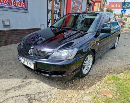Черный Мицубиси Лансер, объемом двигателя 2 л и пробегом 168 тыс. км за 4999 $, фото 1 на Automoto.ua