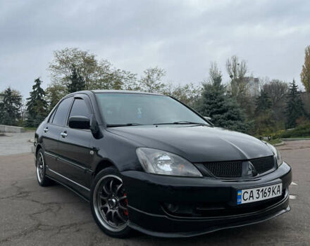Чорний Міцубісі Lancer, об'ємом двигуна 2 л та пробігом 242 тис. км за 5900 $, фото 1 на Automoto.ua