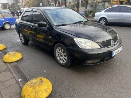 Черный Мицубиси Лансер, объемом двигателя 1.6 л и пробегом 299 тыс. км за 3480 $, фото 1 на Automoto.ua