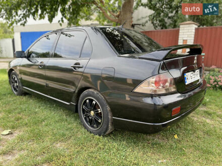 Чорний Міцубісі Lancer, об'ємом двигуна 1.6 л та пробігом 386 тис. км за 4900 $, фото 1 на Automoto.ua