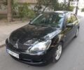 Чорний Міцубісі Lancer, об'ємом двигуна 2 л та пробігом 207 тис. км за 6400 $, фото 1 на Automoto.ua