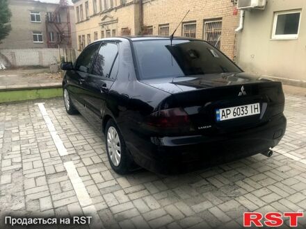 Чорний Міцубісі Lancer, об'ємом двигуна 1.6 л та пробігом 240 тис. км за 4100 $, фото 1 на Automoto.ua