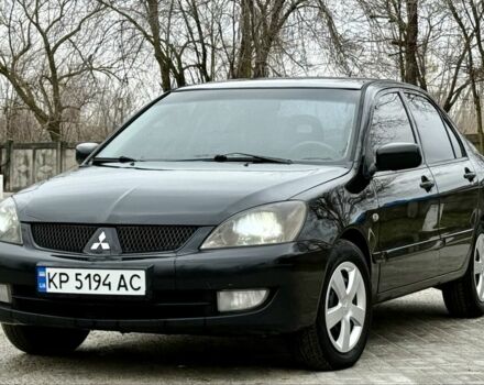 Черный Мицубиси Лансер, объемом двигателя 1.6 л и пробегом 196 тыс. км за 4400 $, фото 1 на Automoto.ua