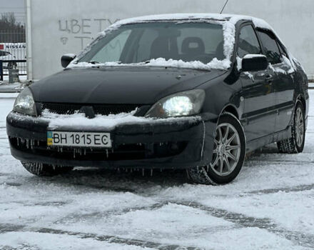 Черный Мицубиси Лансер, объемом двигателя 2 л и пробегом 420 тыс. км за 3599 $, фото 1 на Automoto.ua